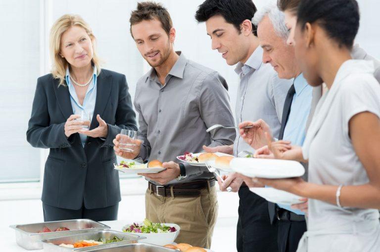 Business Colleagues Eating Meal Together In Restaurant
